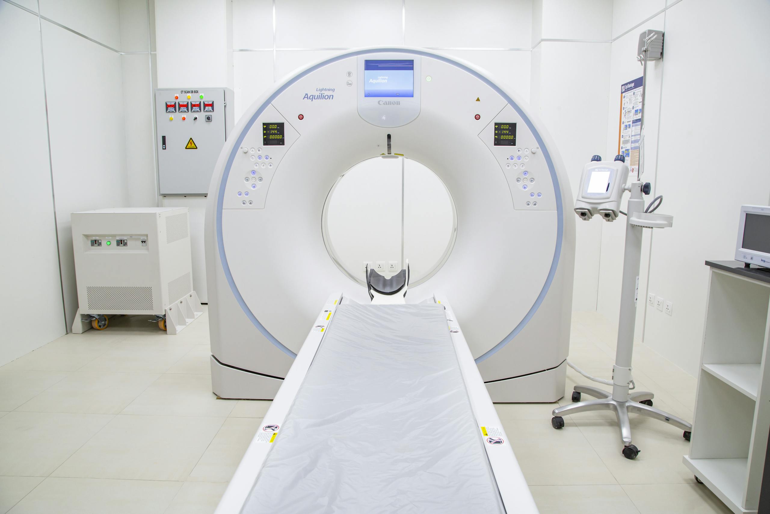 High-quality image of a modern MRI scanner in a sterile hospital room, ready for use.